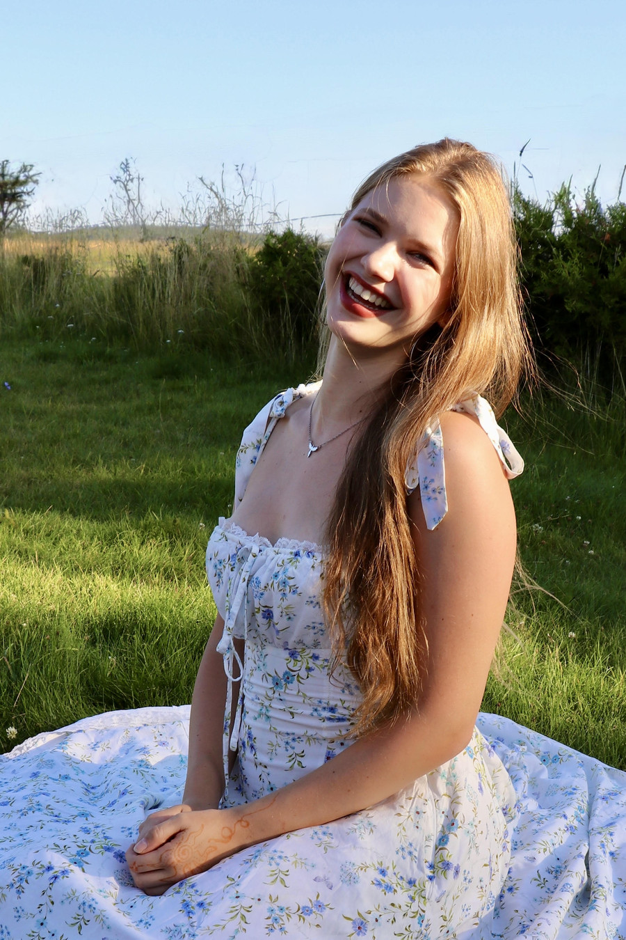 Ella Jezdikova, author of The Thorned Prince, smiling outdoors